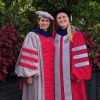 Kelly and Zeynep in PhD regalia
