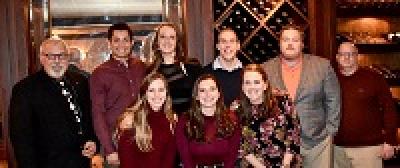 Members of Dr. Kramer's lab posing for a photo at a restaurant