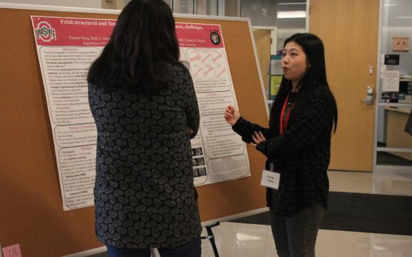 Xinnan explaining her poster