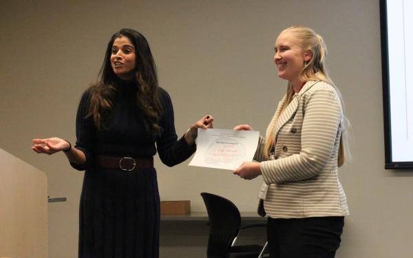 Ruchika presenting Kelly with best oral presentation award